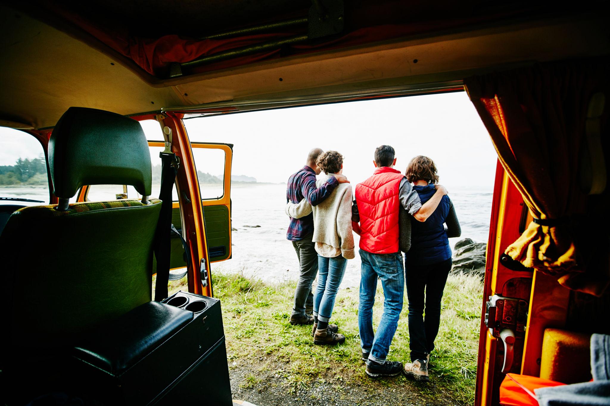 Friends enjoying a road trip together in a Force Urbania vehicle