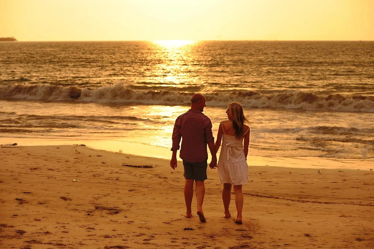Couple enjoying a romantic honeymoon holiday on the beaches of Goa